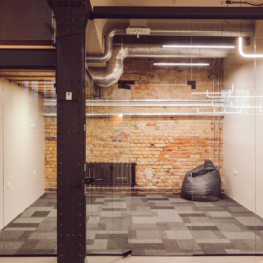 Chill-out area with brick walls at Double9 coworking, Riga